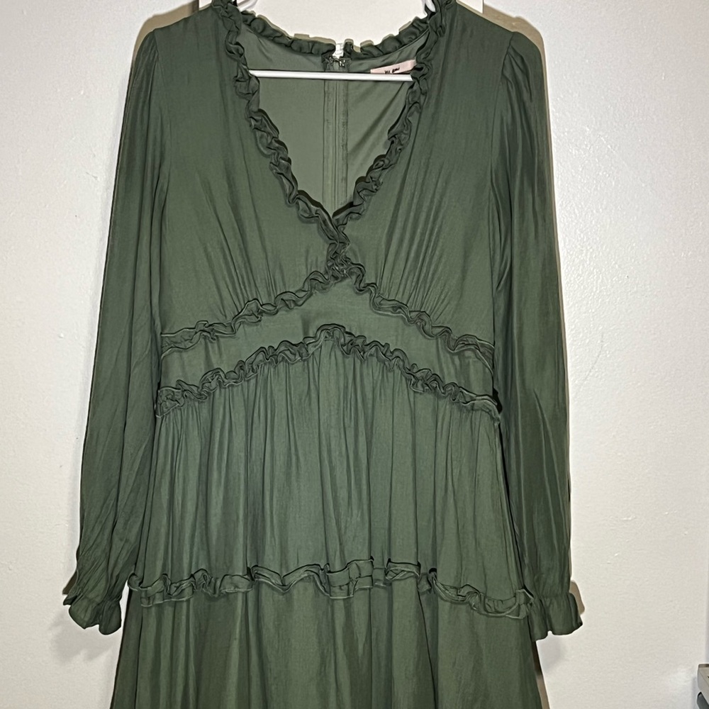 Sage green dress with long sleeves and low cut. Size large.